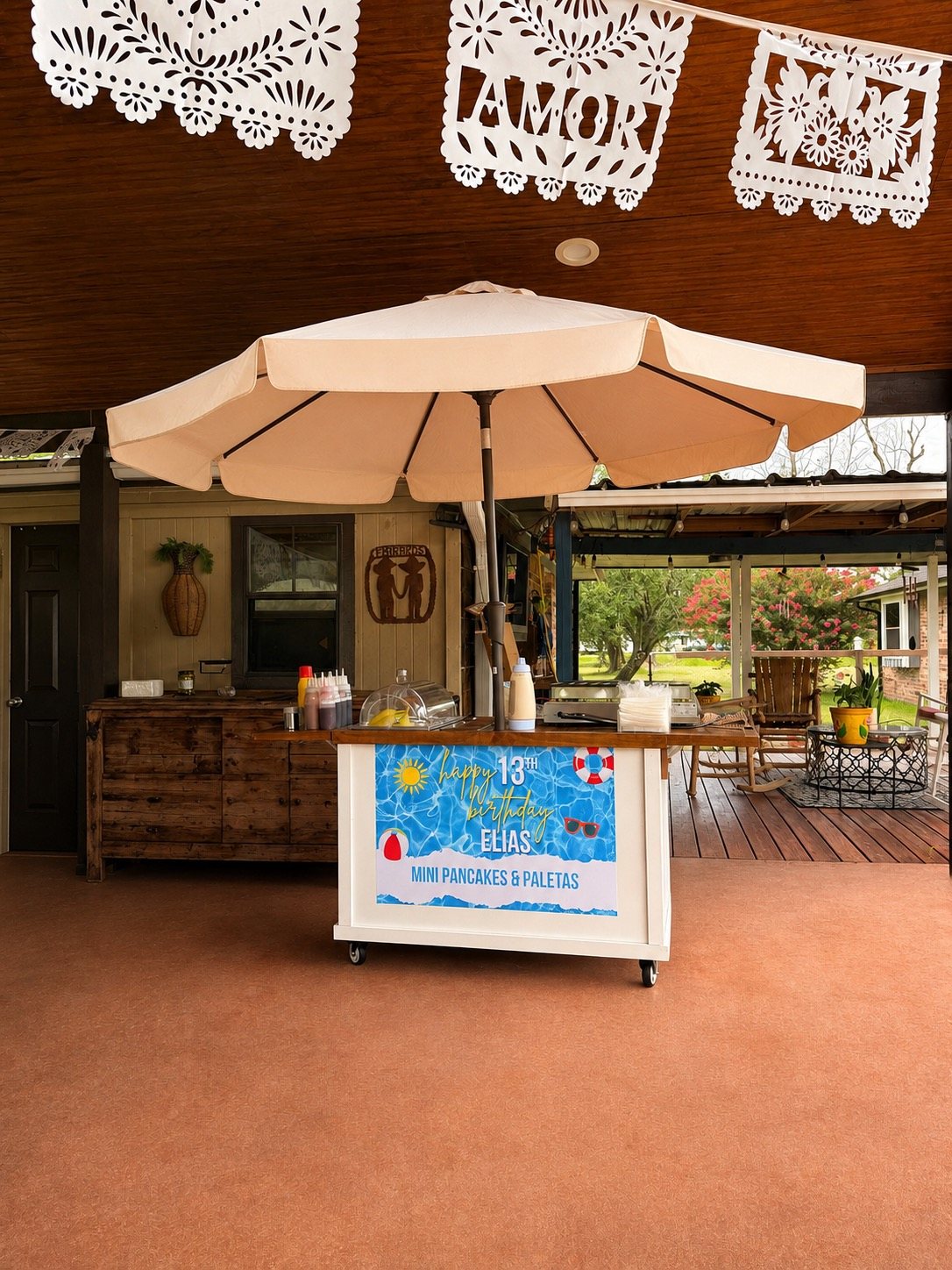 Our cart under its umbrella, set up for mini pancakes and paletas at a birthday
